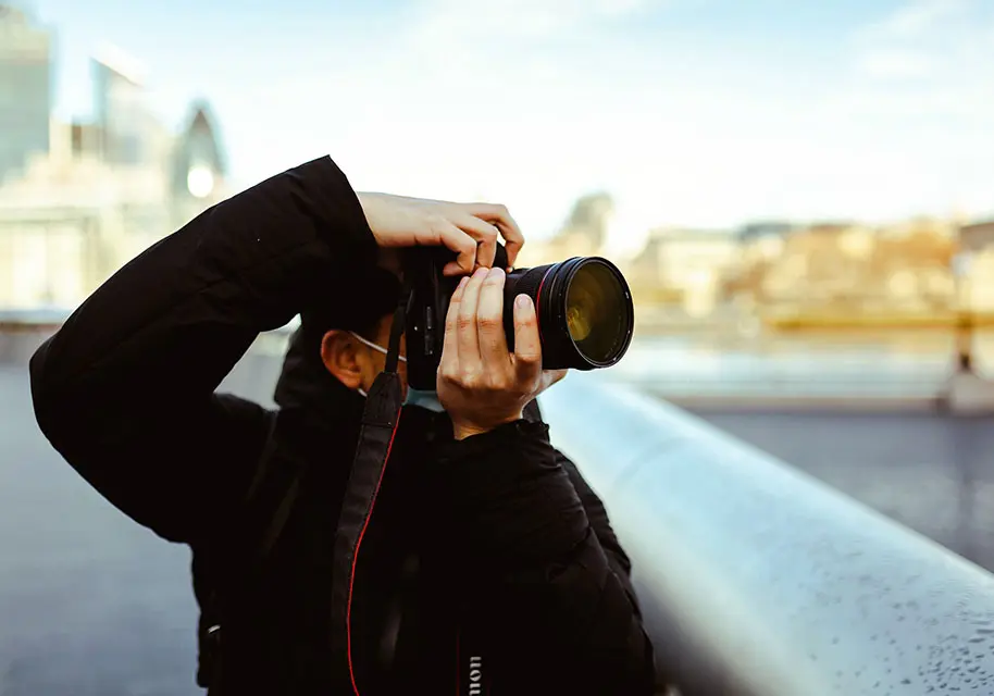 woman holding a camera